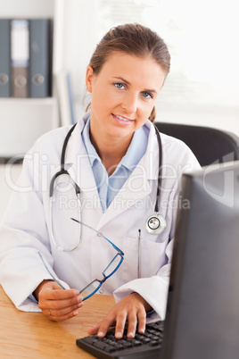 Doctor working with her computer
