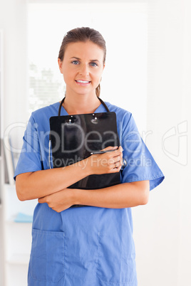 Cute nurse holding a folder