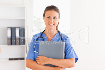 Beautiful nurse holding a folder