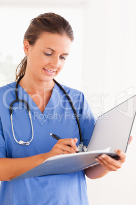 Close up of a doctor with stethoscope and folder