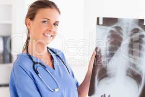 Gorgeous doctor with stethoscope and x-ray