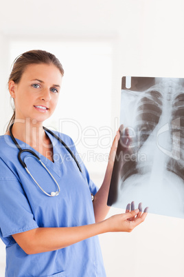 Gorgeous brunette doctor with stethoscope and x-ray