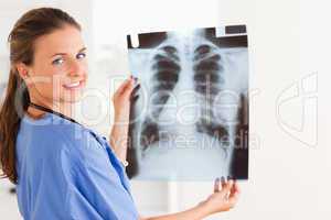 Brunette doctor with x-ray and stethoscope