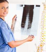 Smiling doctor with a stethoscope and a x-ray