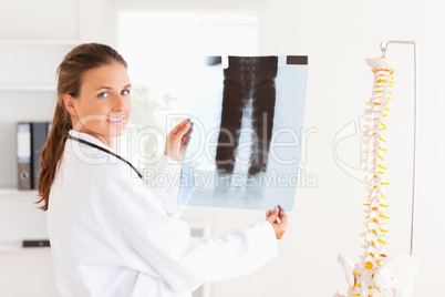 Beautiful doctor with a stethoscope and a x-ray