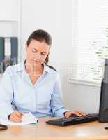 Businesswoman concentrating on a paper