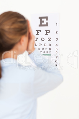 Woman looking at an eye test