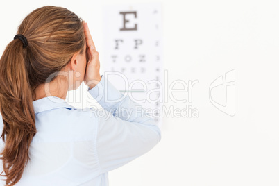 Brunette woman making an eye test