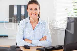 Beautiful businesswoman sitting behind her desk