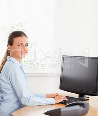 Woman typing on a keyboard