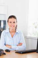 Businesswoman looking into camera in office