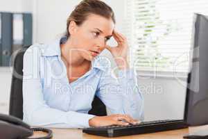 Frustrated woman looking to screen of pc