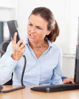 Annoyed businesswoman in office