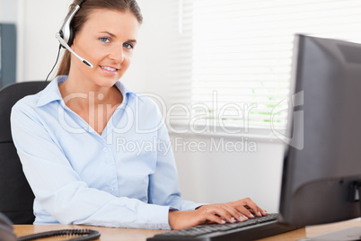 Secretary with headset in an office