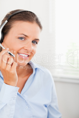 Woman wearing headphones looking into the camera