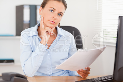 Businesswoman concentrating on a paper