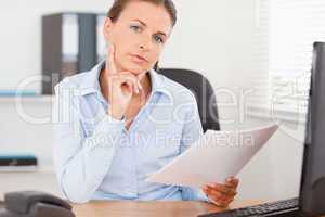 Businesswoman concentrating on a paper