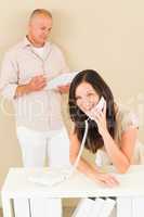 Casual businesswoman calling phone man colleague