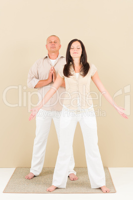 Casual business yoga pose businesspeople standing