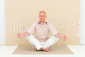 Casual business yoga smiling senior man meditate