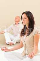 Casual business yoga woman meditating colleague