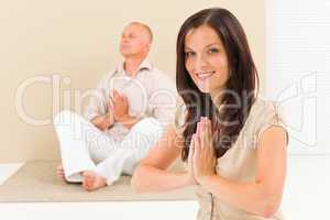 Casual business yoga woman meditating colleague