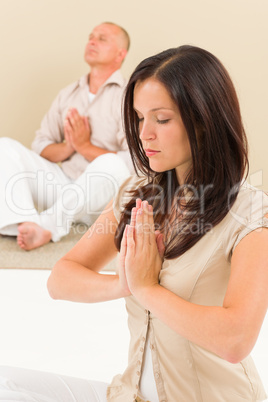 Casual business yoga woman meditating colleague