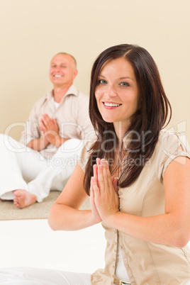 Casual business yoga woman meditating colleague