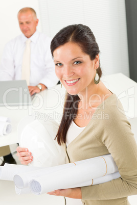 Professional architect woman with blueprint office