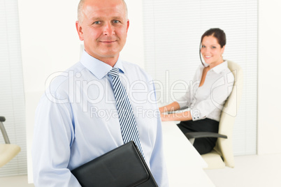 Professional senior businessman hold briefcase