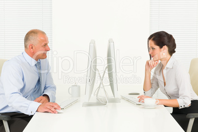 Professional businesspeople sitting in office