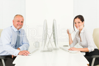 Professional businesspeople sitting in office Professional businesspeople sitting in office