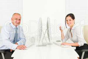 Professional businesspeople sitting in office