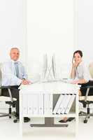 Professional businesspeople sitting in office