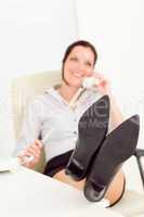 Legs on table relax smiling businesswoman calling