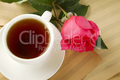 A cup of tea and rose