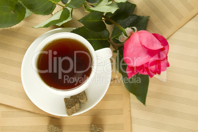 A cup of tea and rose