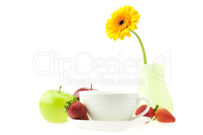 still life of gerbera cups and apples isolated on white