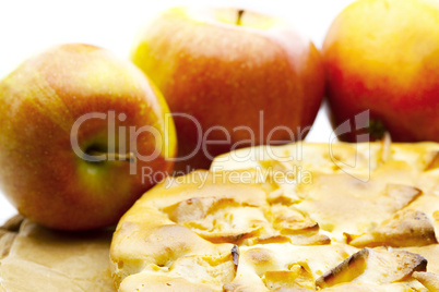 Apples and apple pie  lying on the table