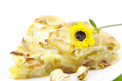 piece of apple pie and a flower isolated on white