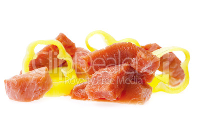 chunks of meat and peppers isolated on white