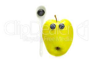 apple with eyes of blueberries isolated on white