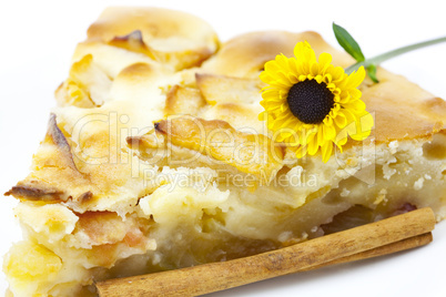 piece of apple pie and a flower isolated on white