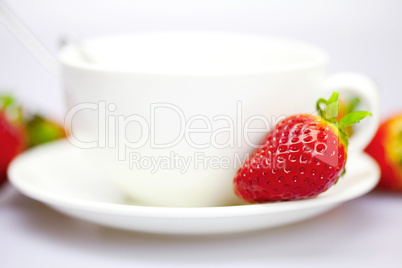 Strawberry on the cup and saucer
