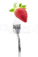 Strawberry on the plug is isolated on a white