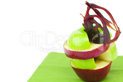 apple slices with caramel hearts isolated on white