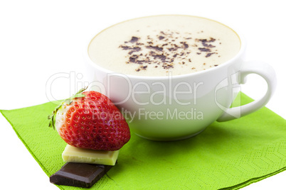 strawberries and chocolate bars lying in a cup