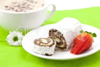 Cappuccino with a sweet roll isolated on white