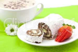 Cappuccino with a sweet roll isolated on white