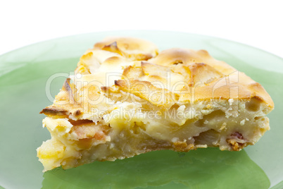 piece of apple pie is isolated on white